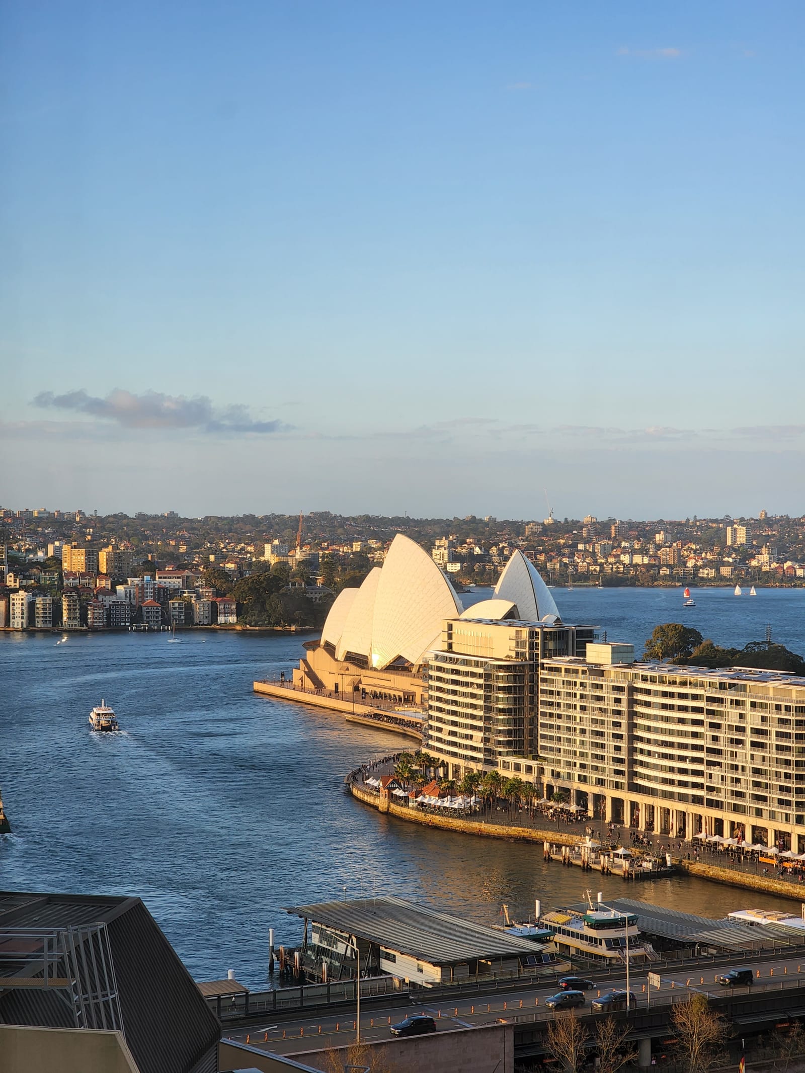 Sydney Opera House and harbour at golden hour